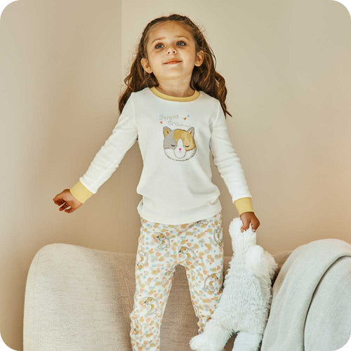 Image 87: Toddler holding Soft Plush Warmies while wearing Calico Cat Pajamas - Warmies